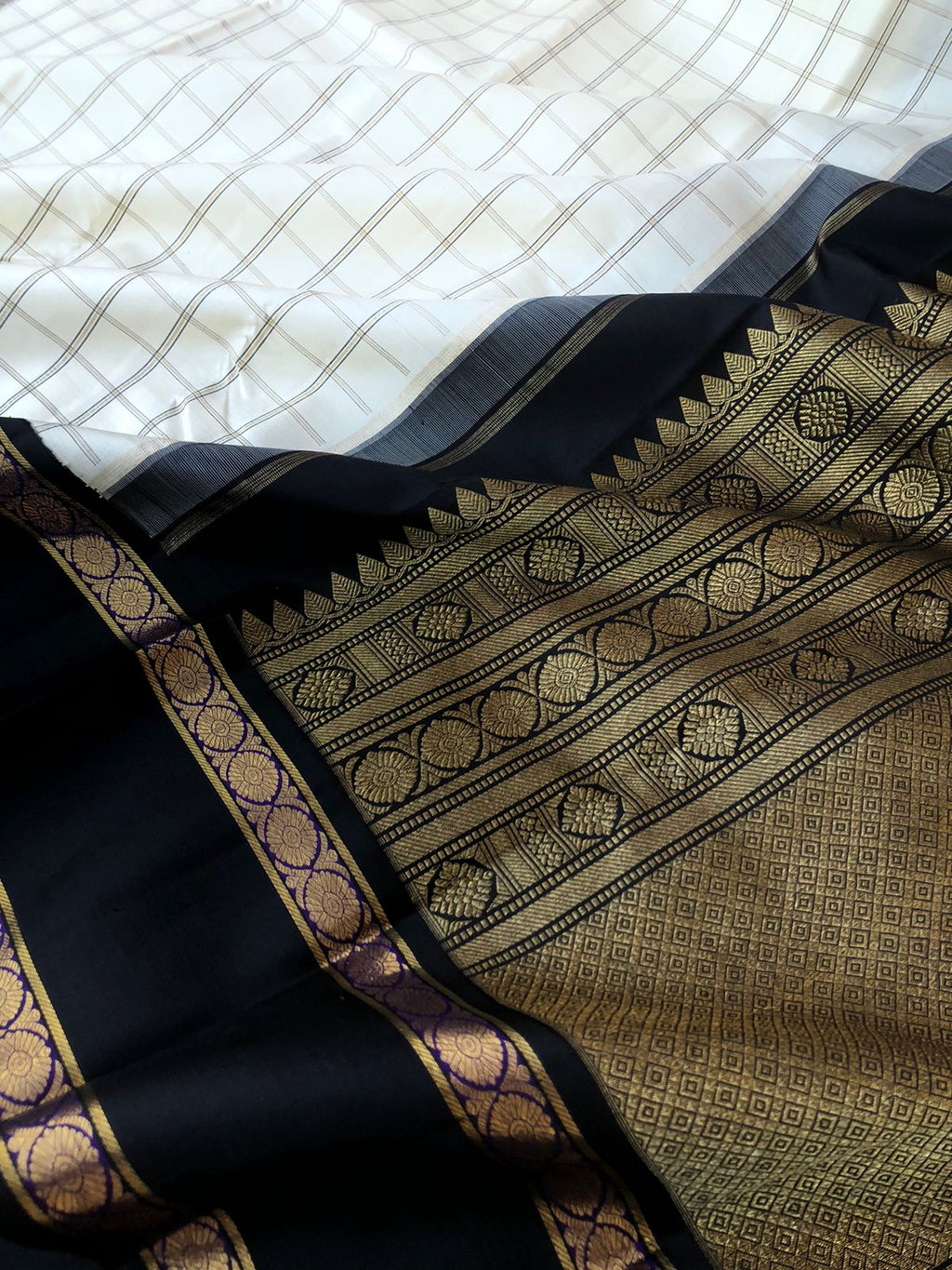 Vintage Ragas on Kanchivaram - the most smartest off white and black muthukattam woven body with retta pett woven borders