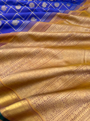 Colours of Navarathri 2025 on Kanchivarams - the traditional blue Mayil chackaram woven inside the veldhari kattam with intricate woven pallu