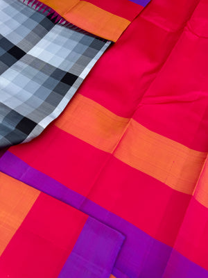 One of the most difficult Kanchivaram Silk - the weaver has to handle seven shuttles ( 5 for body and 2 for the borders ) digital grey black off white chex with three colour band woven borders
