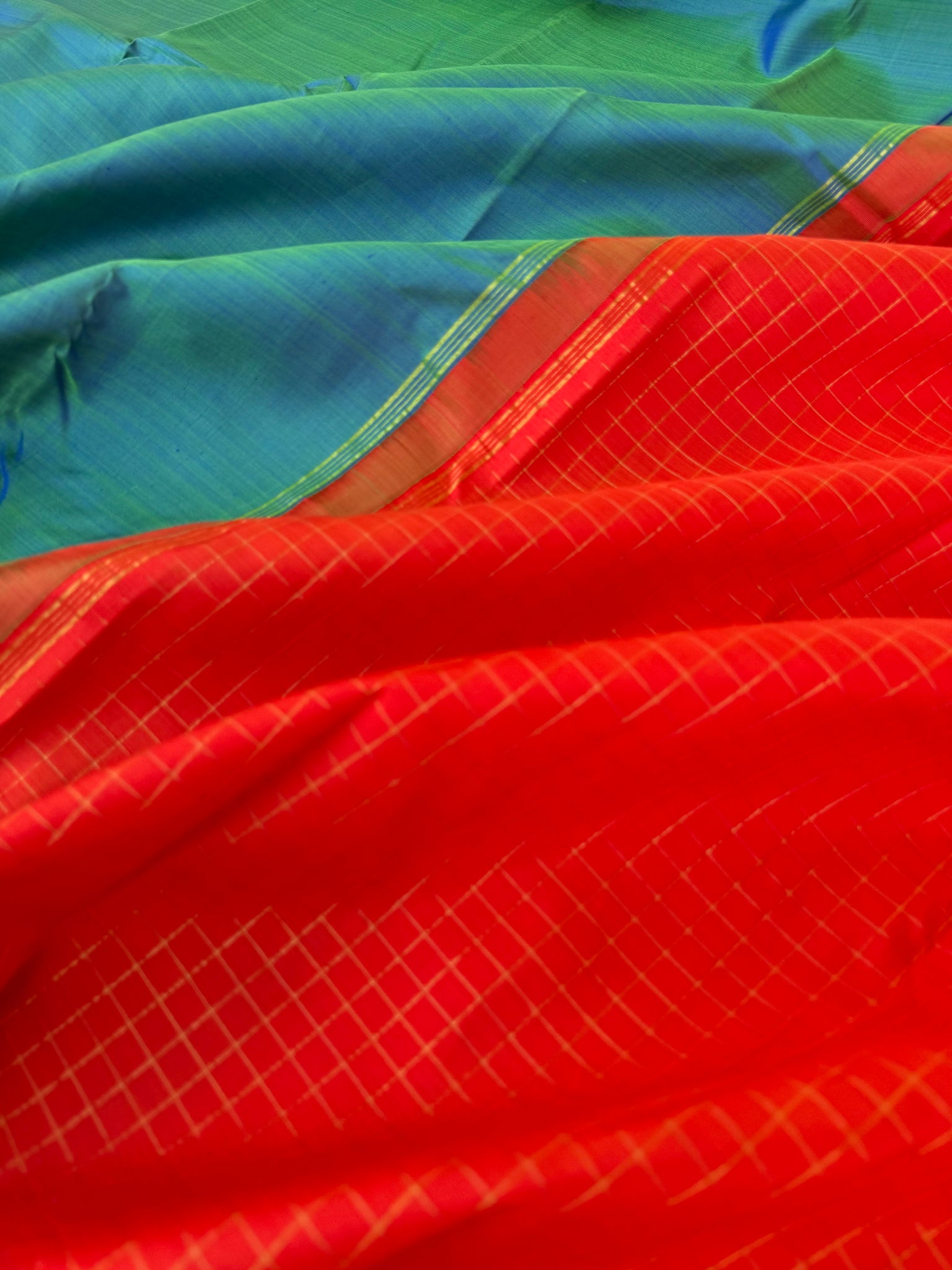 Contrast Play Kanchivarams - dual tone teal with flame orange pallu and blouse chex
