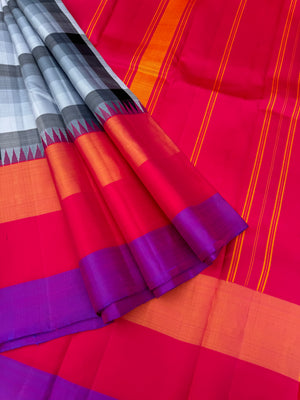 One of the most difficult Kanchivaram Silk - the weaver has to handle seven shuttles ( 5 for body and 2 for the borders ) digital grey black off white chex with three colour band woven borders