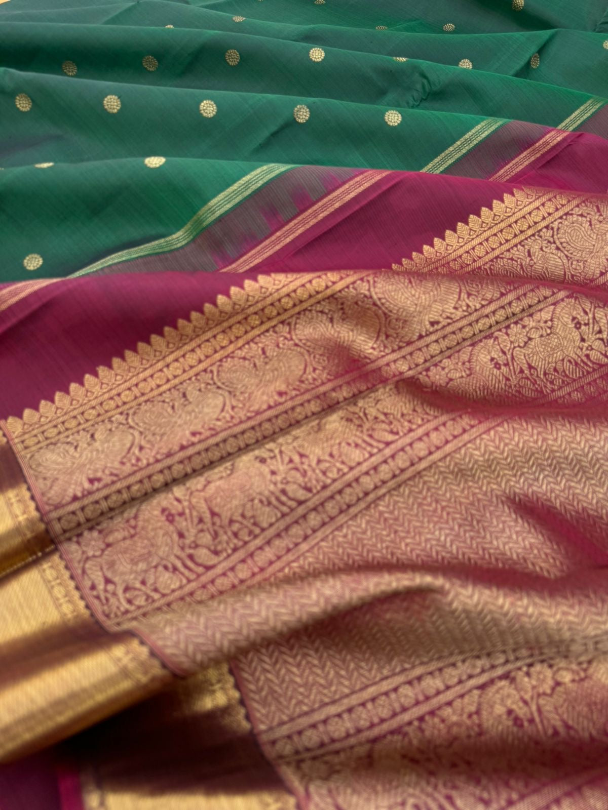Colour Play on Kanchivaram - the beautiful deep dark meenakshi green with aaraku pallu and blouse with solid gold zari woven borders