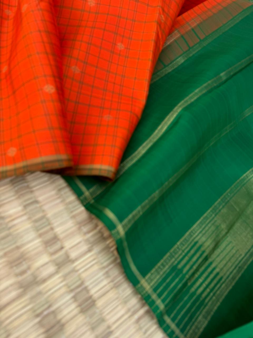 Kanchivaram Trunk - a simple elegant kattam buttas with borderless concept !! In orange and green combination