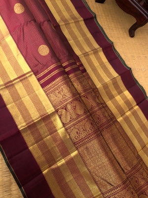 Kamakshi - One of  a Kind Kanchivaram - the grand of grandest aaraku maroon Vairaoosi kattam with chackaram woven buttas on 5 row woven aarai maadam borders