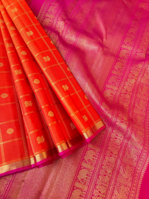 Aandal - The grandeur Kanchivaram - stunning orange and pink veldhari chex mayail chackaram