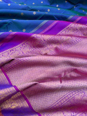 Valli - stunning peacock blue green with violet woven borders and pallu with traditional elephant woven borders