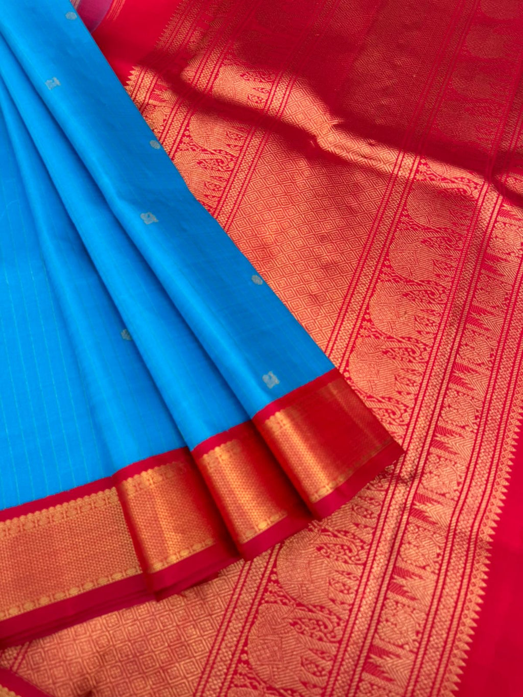 Kanchivaram Trunk - gorgeous Anandha blue and red with vertical zari strips and buttas with aarai maadam woven borders