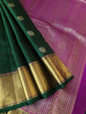 Tara - Traditional Colours on Traditional Kanchivarams - the most beautiful stunning Meenakshi green and majenta pink purple Vairaoosi kattam and mayil chackaram woven body with full gold solid broad borders