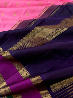 Tales of Korvais Kanchivaram - light tone of baby pink and navy fish pett woven borders
