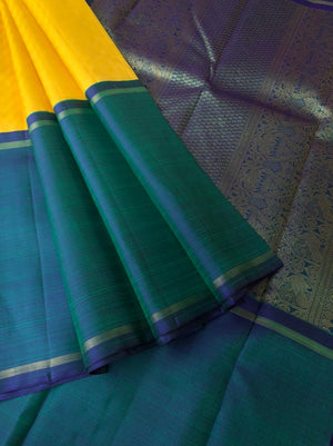 Meenakshi - Kanchivaram for Every Occasion - lemon yellow and Mayil kaluthu mubbagam with body woven with chevron motifs