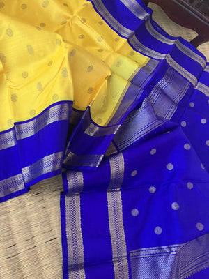 Meenakshi - Kanchivaram for Every Occasion - lovely lemon yellow and ms blue korvai Kanchivaram