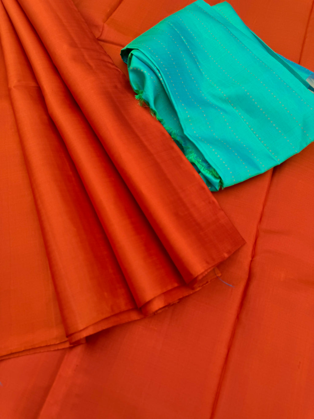Niram - Celebrating of Colours of Full Plain Kanchivaram Silks Paired with Beautiful Contrasting Blouses - rust orange saree with kanchivaram silk dual tone aqua blouse