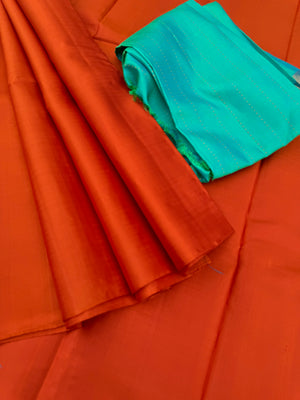 Niram - Celebrating of Colours of Full Plain Kanchivaram Silks Paired with Beautiful Contrasting Blouses - rust orange saree with kanchivaram silk dual tone aqua blouse