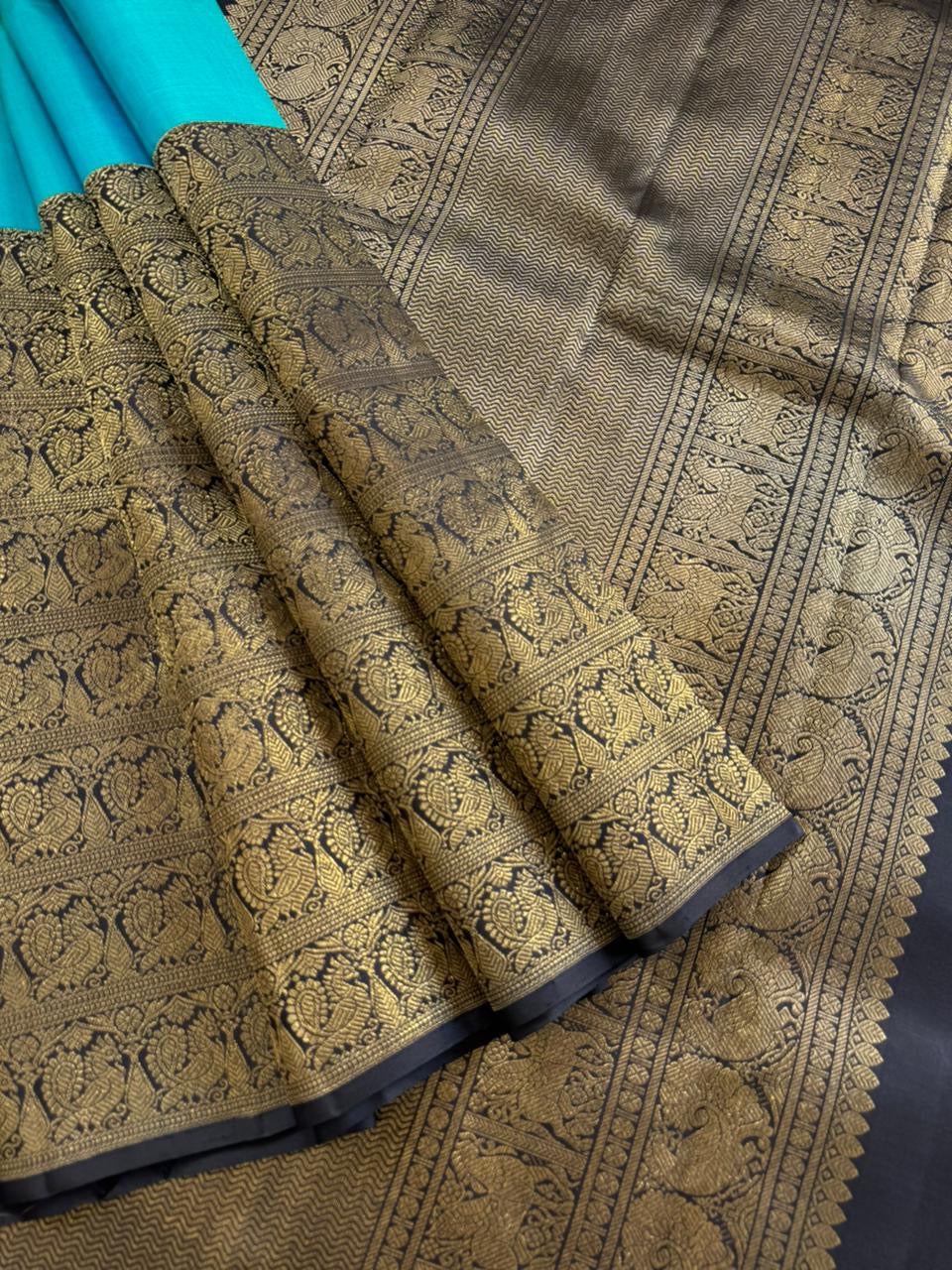 Tasteful Tall Border Kanchivarams - lovely dual tone blue and black with long zari woven one side korvai borders with grand pallu