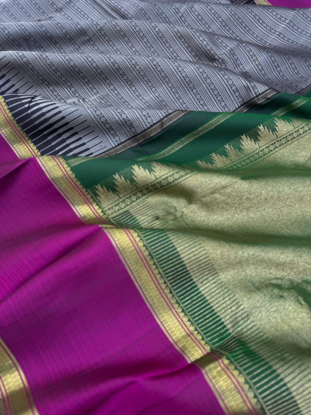 Haritham - Heirloom Yarn Play on Kanchivaram - a grey black full body varusai pett with green pallu and blouse with majentha borders