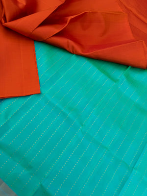 Niram - Celebrating of Colours of Full Plain Kanchivaram Silks Paired with Beautiful Contrasting Blouses - rust orange saree with kanchivaram silk dual tone aqua blouse