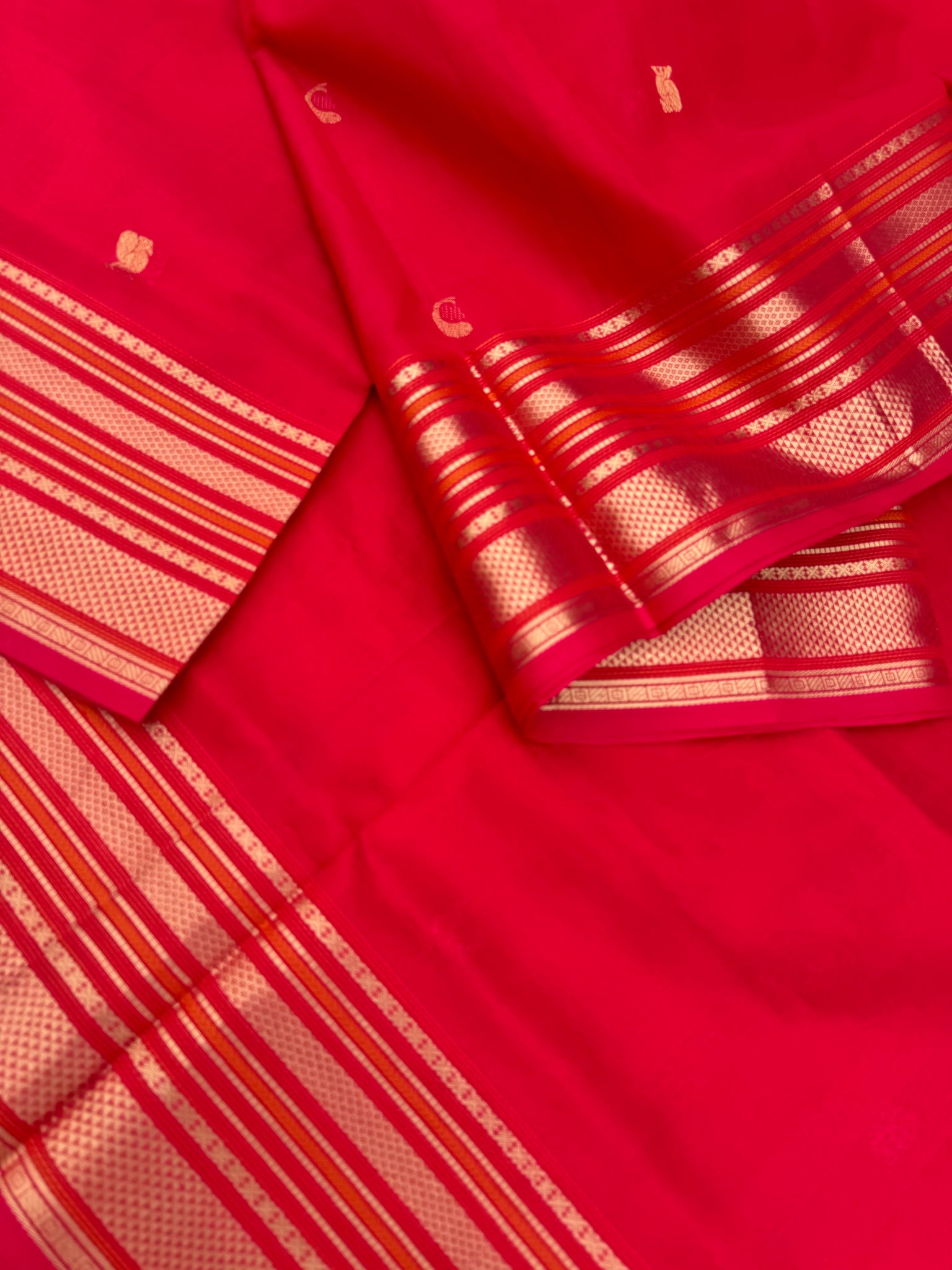 Zari Kissed Silk Cotton - tomato red grand borders and pallu with corner buttas