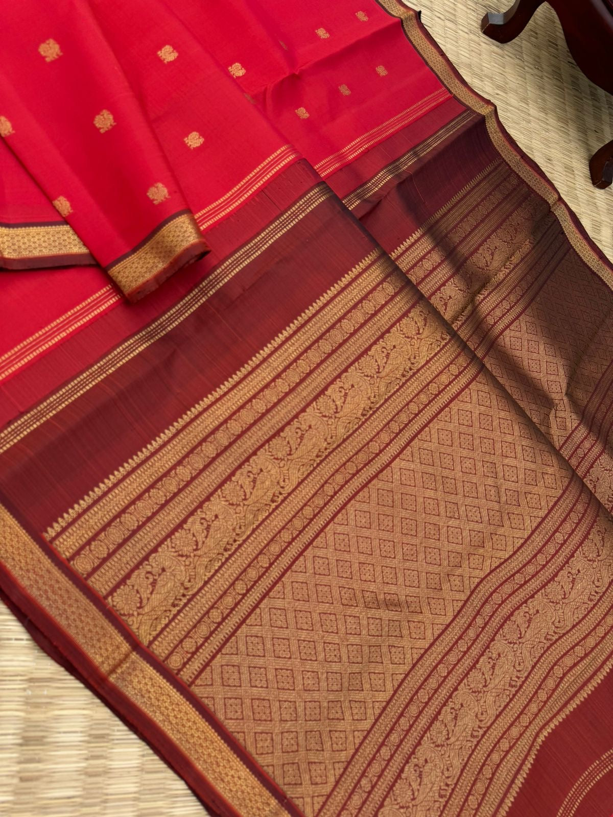 Leela - The bliss of small border Kanchivarams - brick red and maroon the best part of the saree is blouse has woven buttas