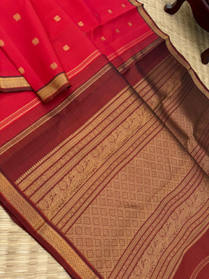 Leela - The bliss of small border Kanchivarams - brick red and maroon the best part of the saree is blouse has woven buttas