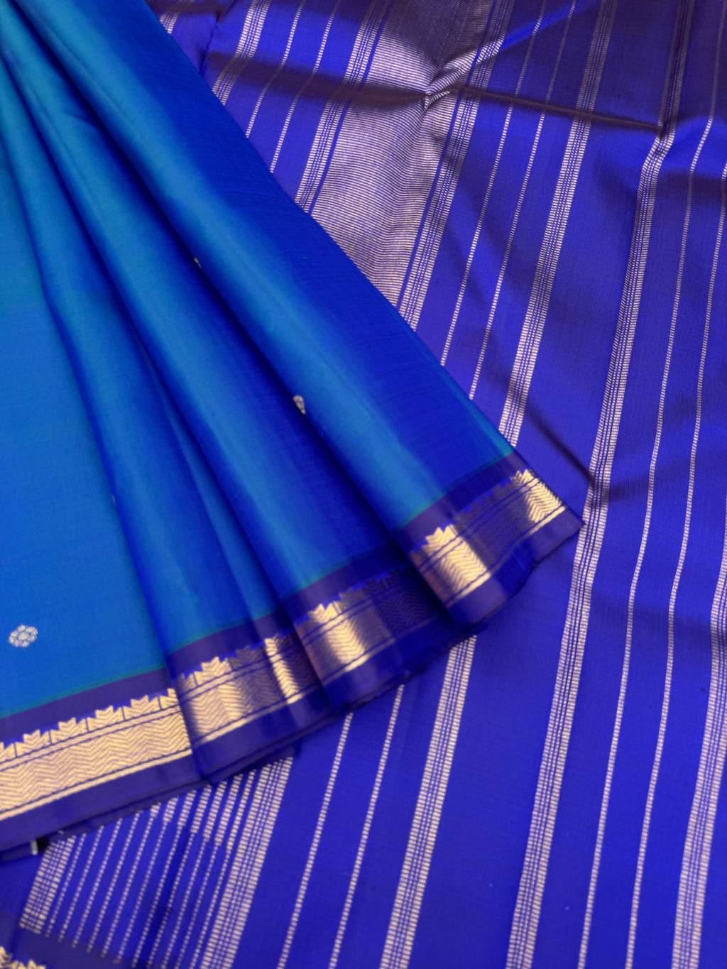 Leela - a mostly beautiful peacock blue green dual tone body with deep dark ink blue pallu and blouse