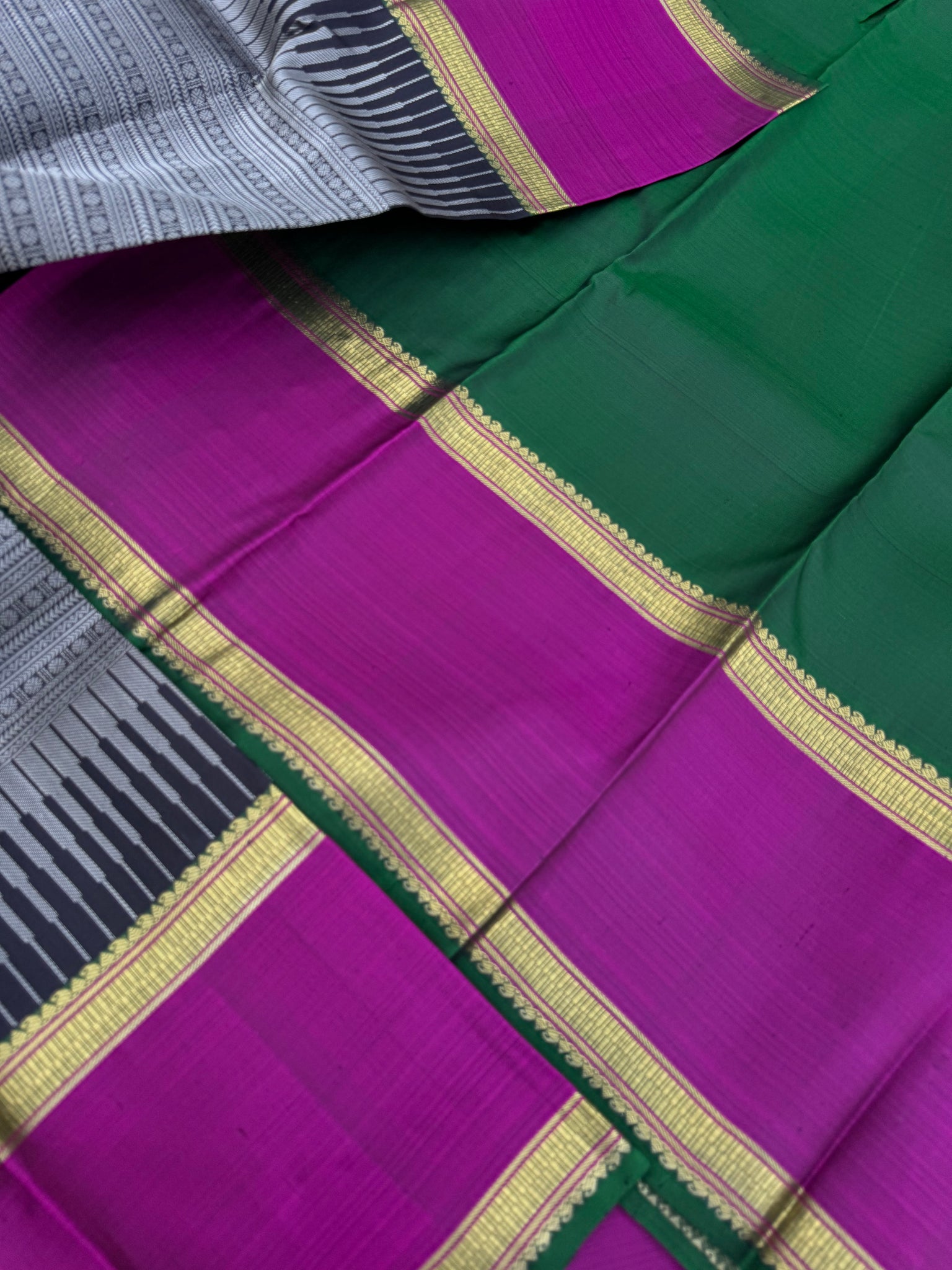 Haritham - Heirloom Yarn Play on Kanchivaram - a grey black full body varusai pett with green pallu and blouse with majentha borders