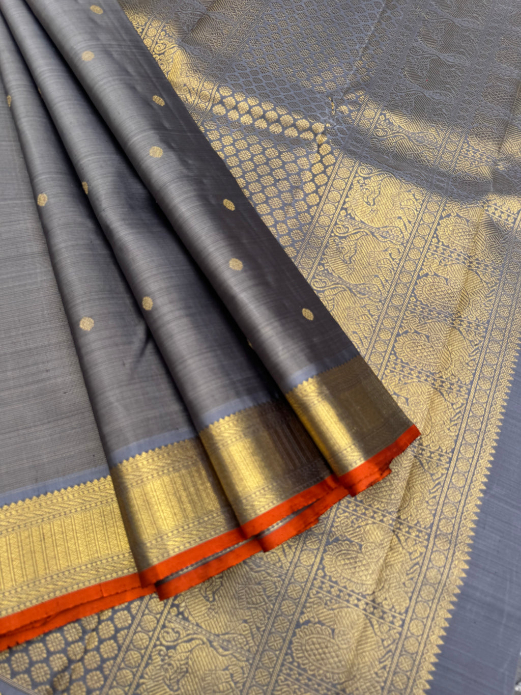 Molten Play on Kanchivaram - a stunning unusual molten Metallic grey vairaoosi the best part of the saree is the burnt orange sleeve edge