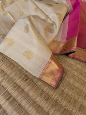 Swarnam - Stunning Solid Border Kanchivarams - off white with a tinch of gold tone body with baby pink pallu