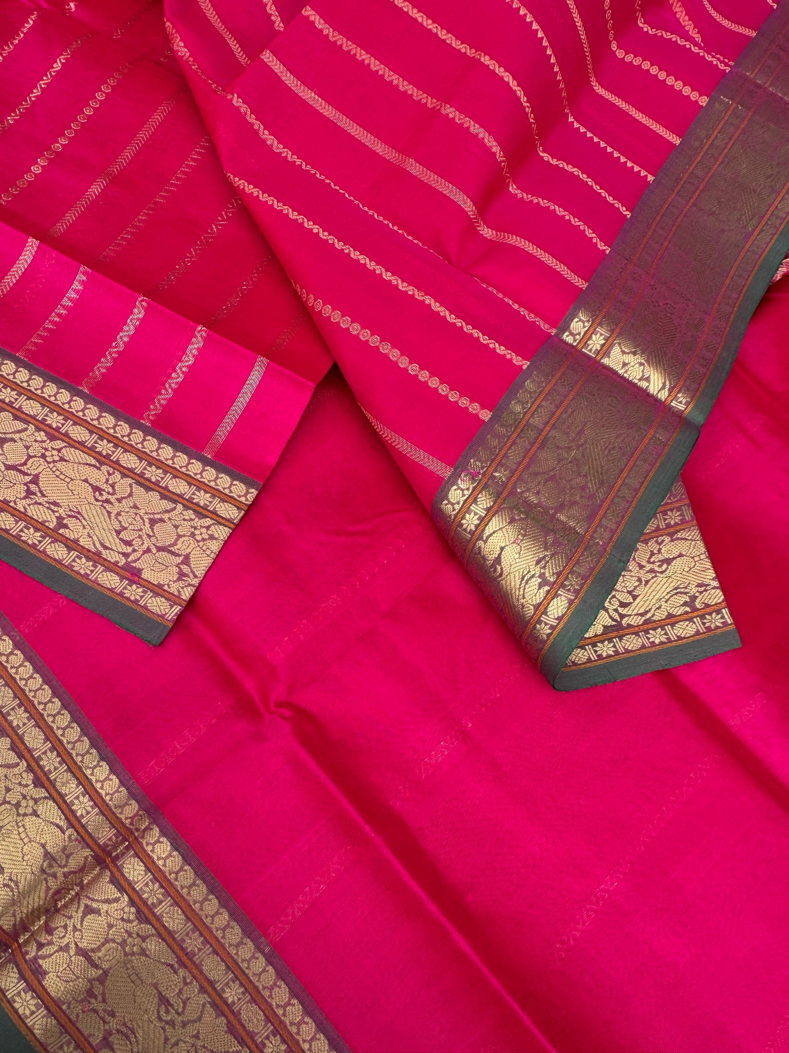 Zari Kissed Silk Cotton - reddish pink vertical veldhari with parrots woven borders