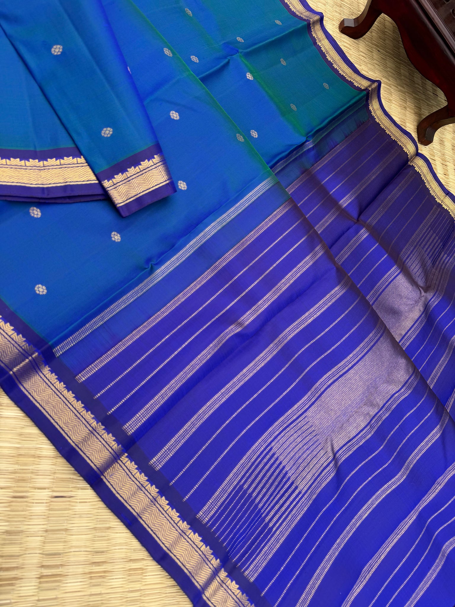 Leela - a mostly beautiful peacock blue green dual tone body with deep dark ink blue pallu and blouse