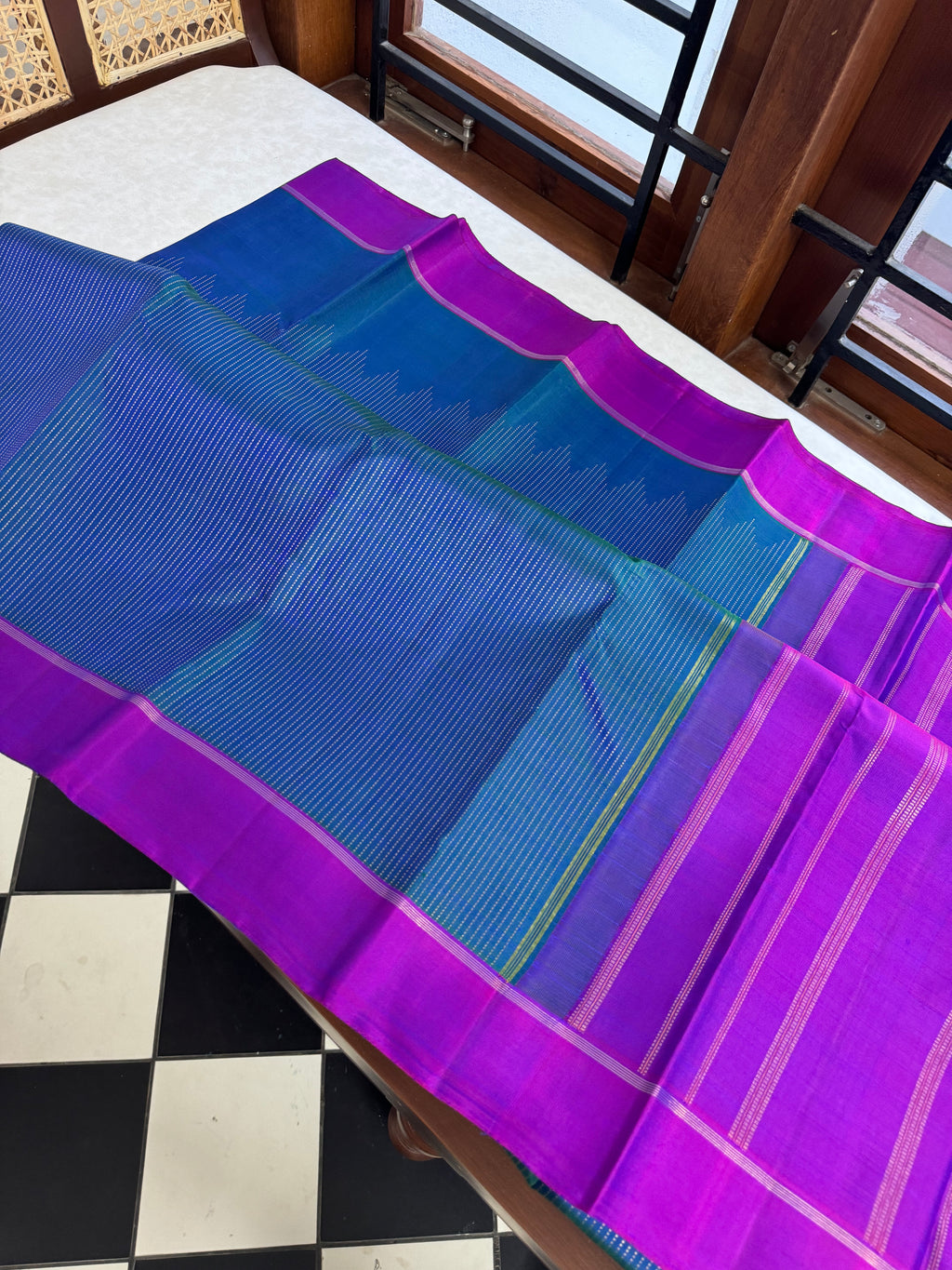 Adhyayam – The No Motifs Kanchivaram - the beautiful raising oosi vaanam in stunning dual tone peacock blue green body and majentha borders pallu and blouse