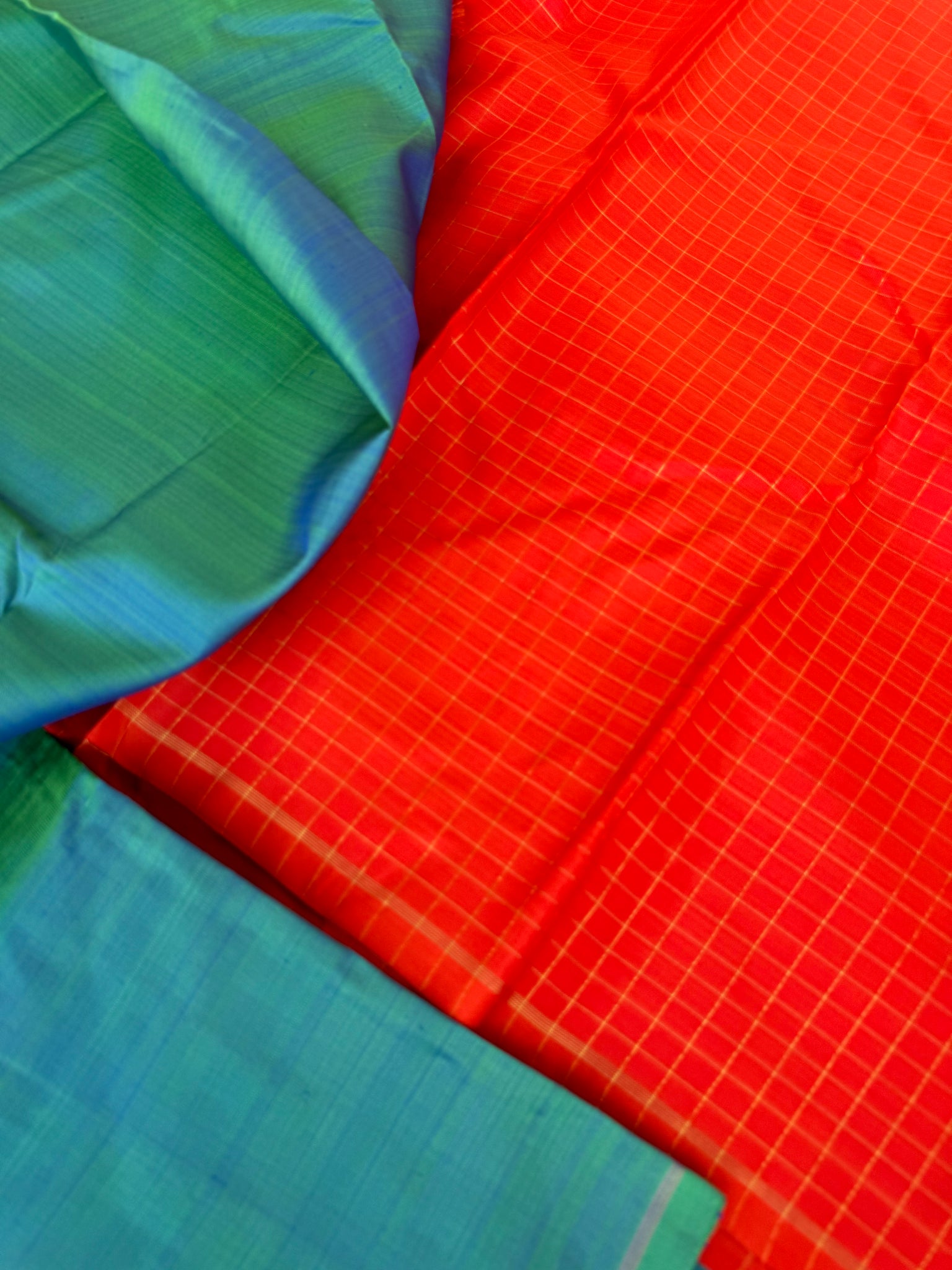 Contrast Play Kanchivarams - dual tone teal with flame orange pallu and blouse chex