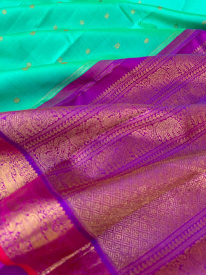 Tales of Korvais Kanchivaram - the stunning dual tone aqua blue green with violet yali and annapakshi woven borders