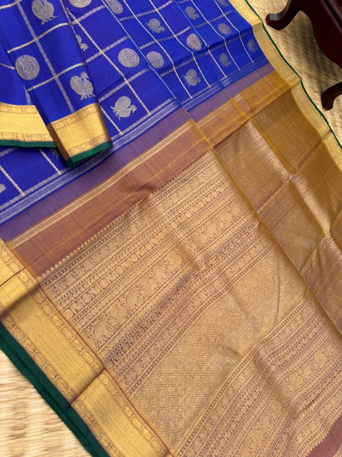 Colours of Navarathri 2025 on Kanchivarams - the traditional blue Mayil chackaram woven inside the veldhari kattam with intricate woven pallu