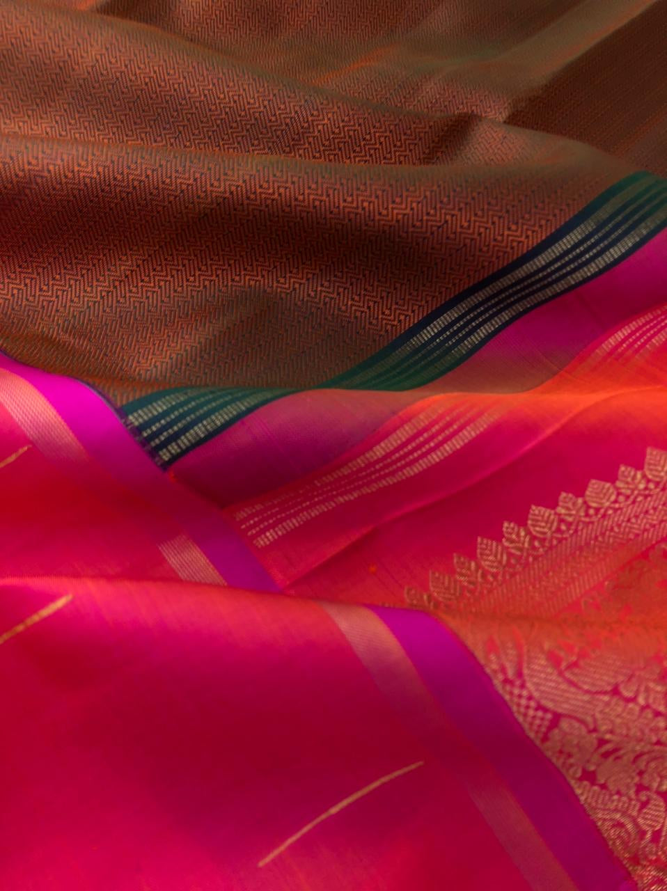 Meenakshi - Kanchivaram for Every Occasion - stunning copper tone body mubbagam with orangish pink rain drops woven borders