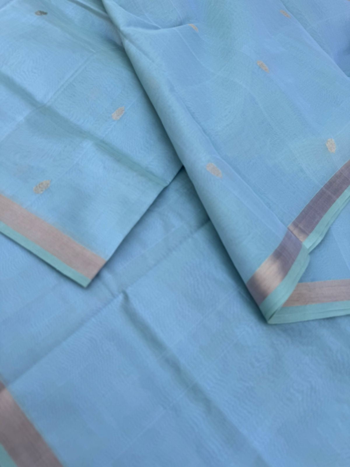 Pastels on Zari Kissed Silk Cotton - a pastel ice blue with one inch tissue borders and grand pallu ( u need to view this saree in natural light )