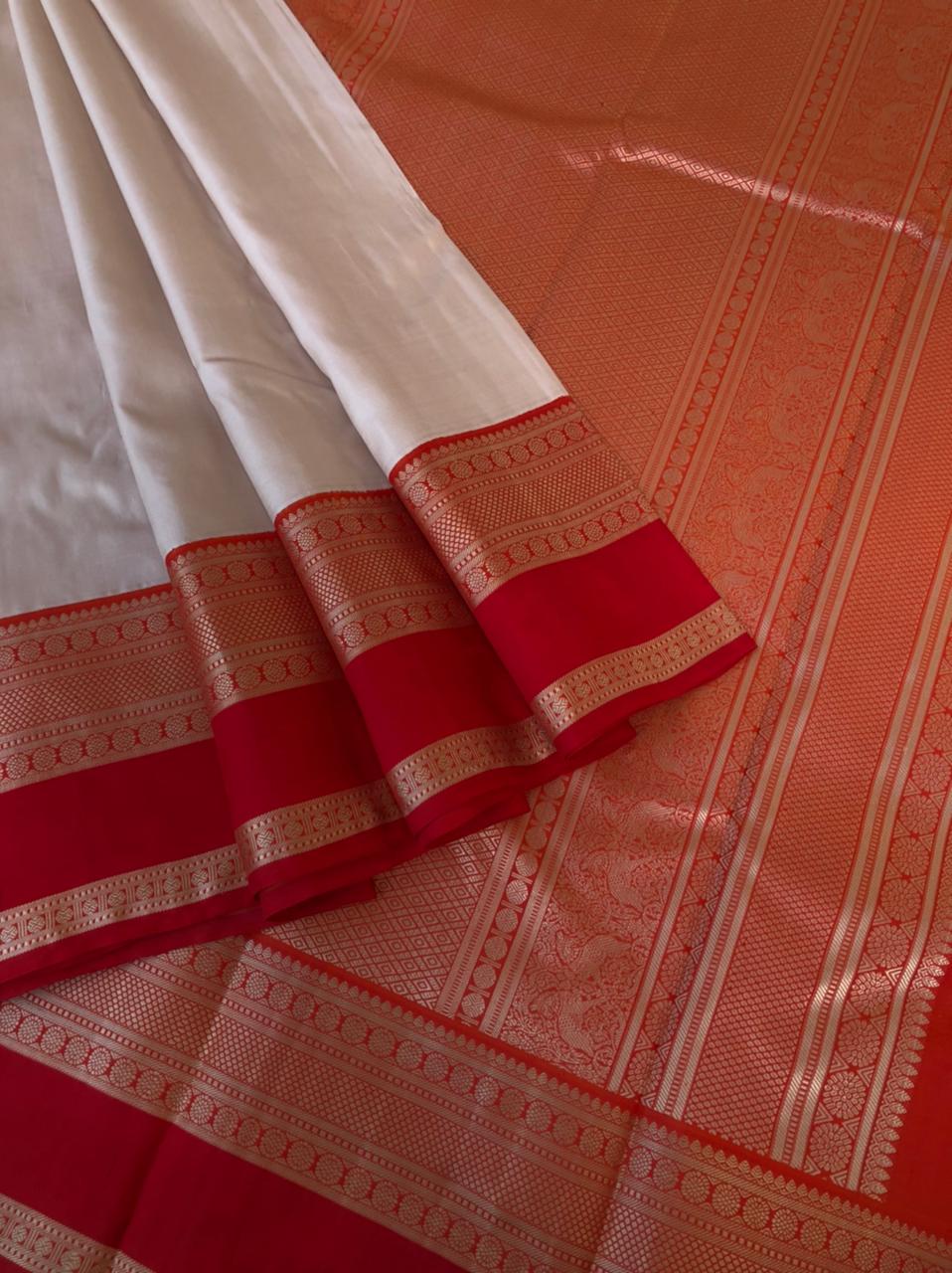 Varam - Kanchivarams Inspired from our Grandmother’s Trunk - one of a kind ivory off white and red/orange no zari korvai Kanchivaram with intricate woven pallu