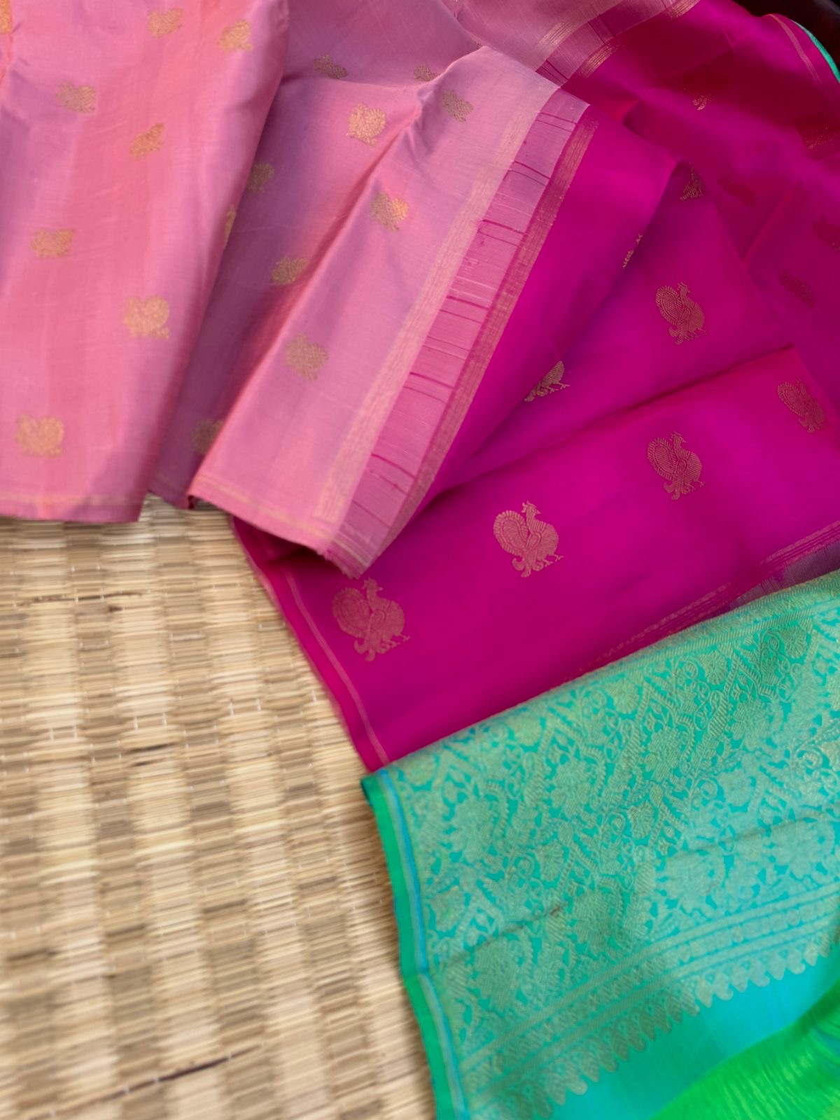 Uniquely Woven Kanchivarams - baby pink Mayil chackaram woven body with rain pink and aqua two colour woven long pallu