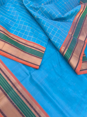Pastels on Zari Kissed Silk Cotton - a unique powder blue with muthukattam and buttas woven together
