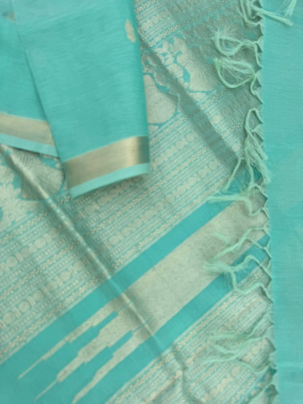 Pastels on Zari Kissed Silk Cotton - a pastel mint green with one inch tissue borders