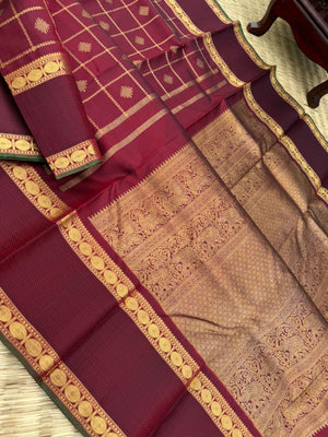 Annapoorani - the gorgeous deep maroon and gold with veldhari kolam buttas woven body with retta pett woven borders