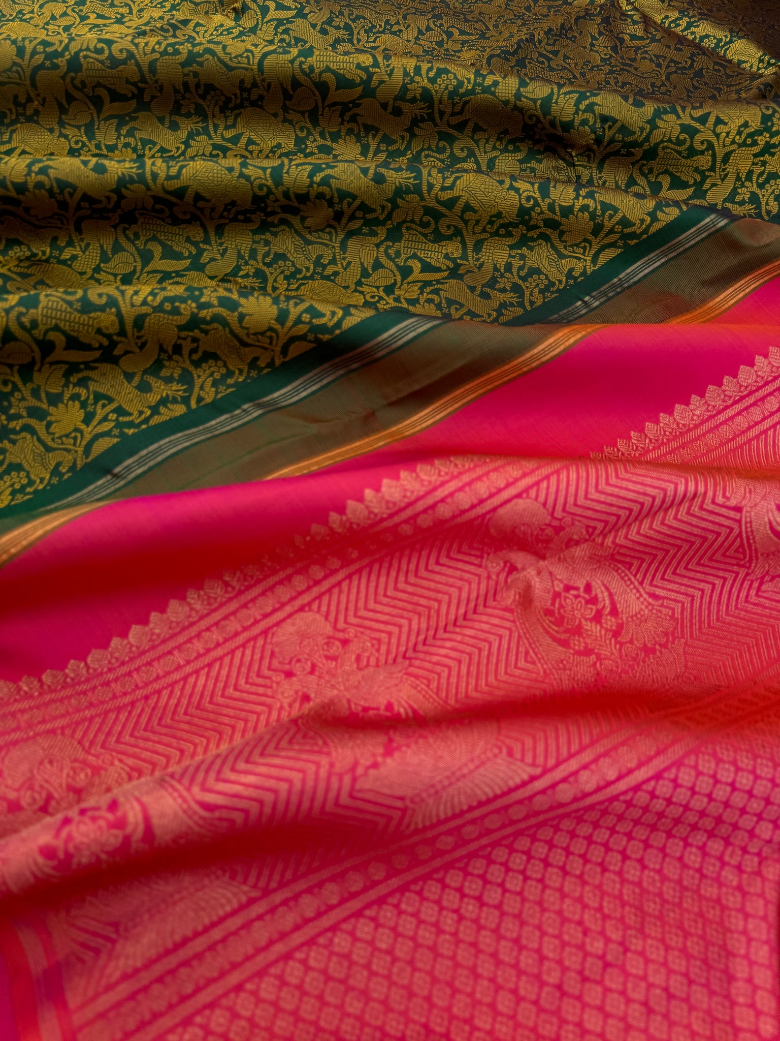 Haritham - Heirloom Yarn Play on Kanchivaram - a stunning deep green base and mustard silk weave vanasingaram with orangish pink dual tone pallu ans blouse