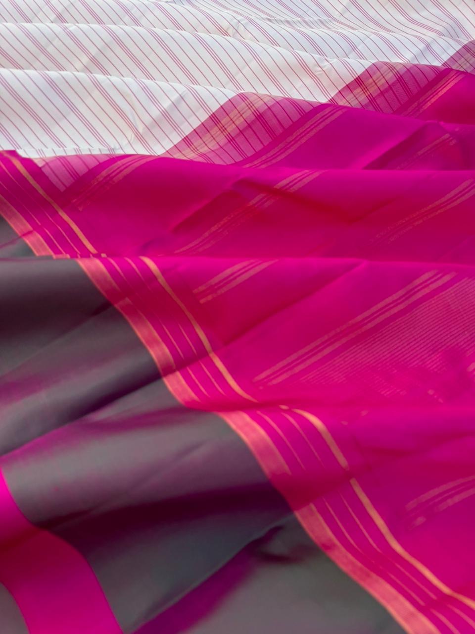 Recipe of Rarest Korvai Kanchivaram - off white stripes woven body with pink and short green korvai borders
