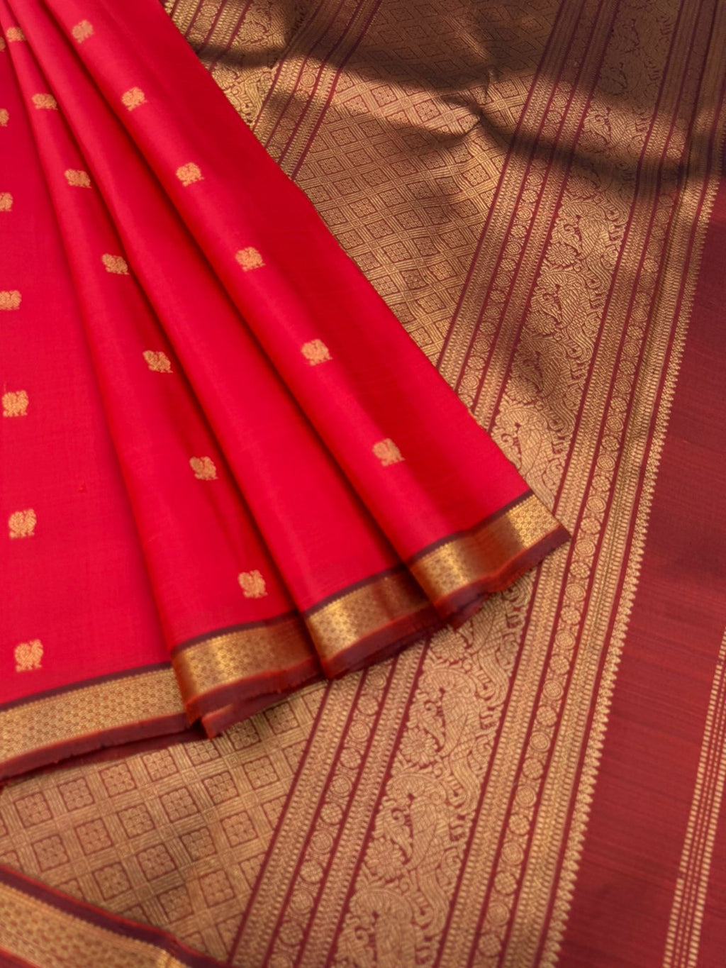 Leela - The bliss of small border Kanchivarams - brick red and maroon the best part of the saree is blouse has woven buttas