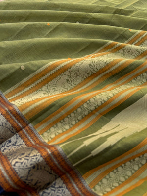 Mangalavastaram - a stunning deep algae green with elephant woven borders