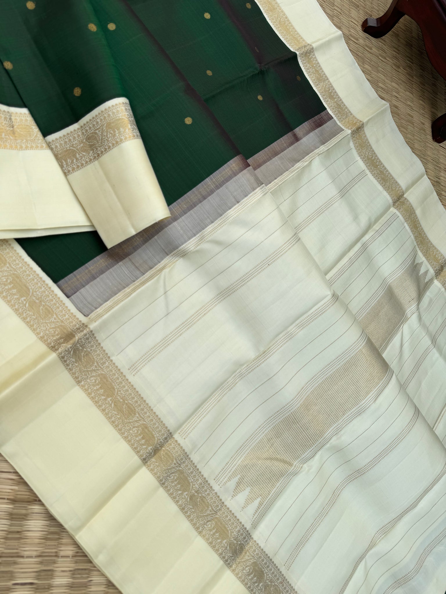 “Iyarkai” (இயற்கை) - Kanchivaram Colours Inspired from Mother Nature - a stunning deep dark bottle green and off white Korvai kanchivaram with kall erangina borders