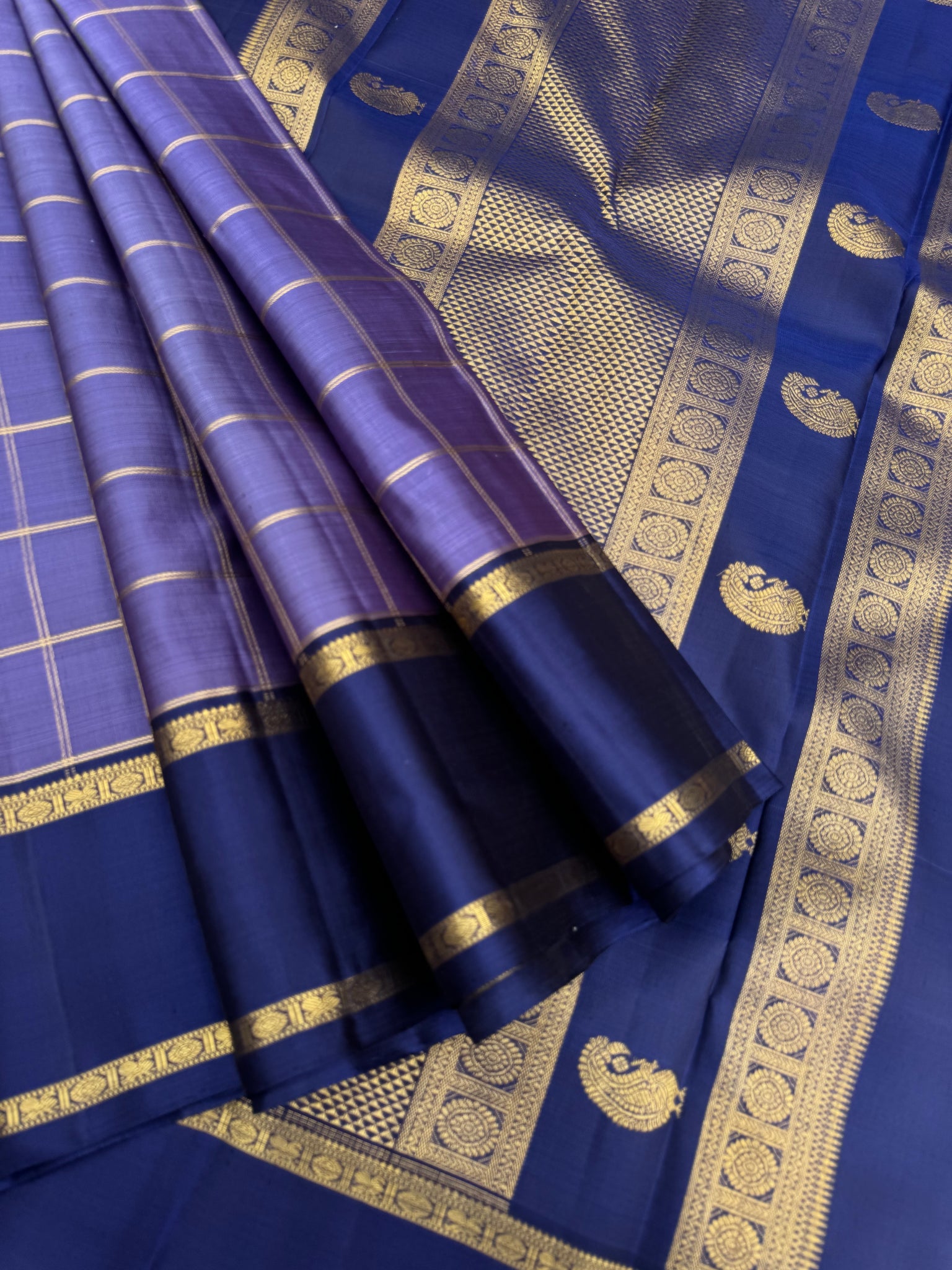 Molten Play on Kanchivaram - a most gorgeous metallic deep lavender and navy blue with kattam woven body and unique pallu