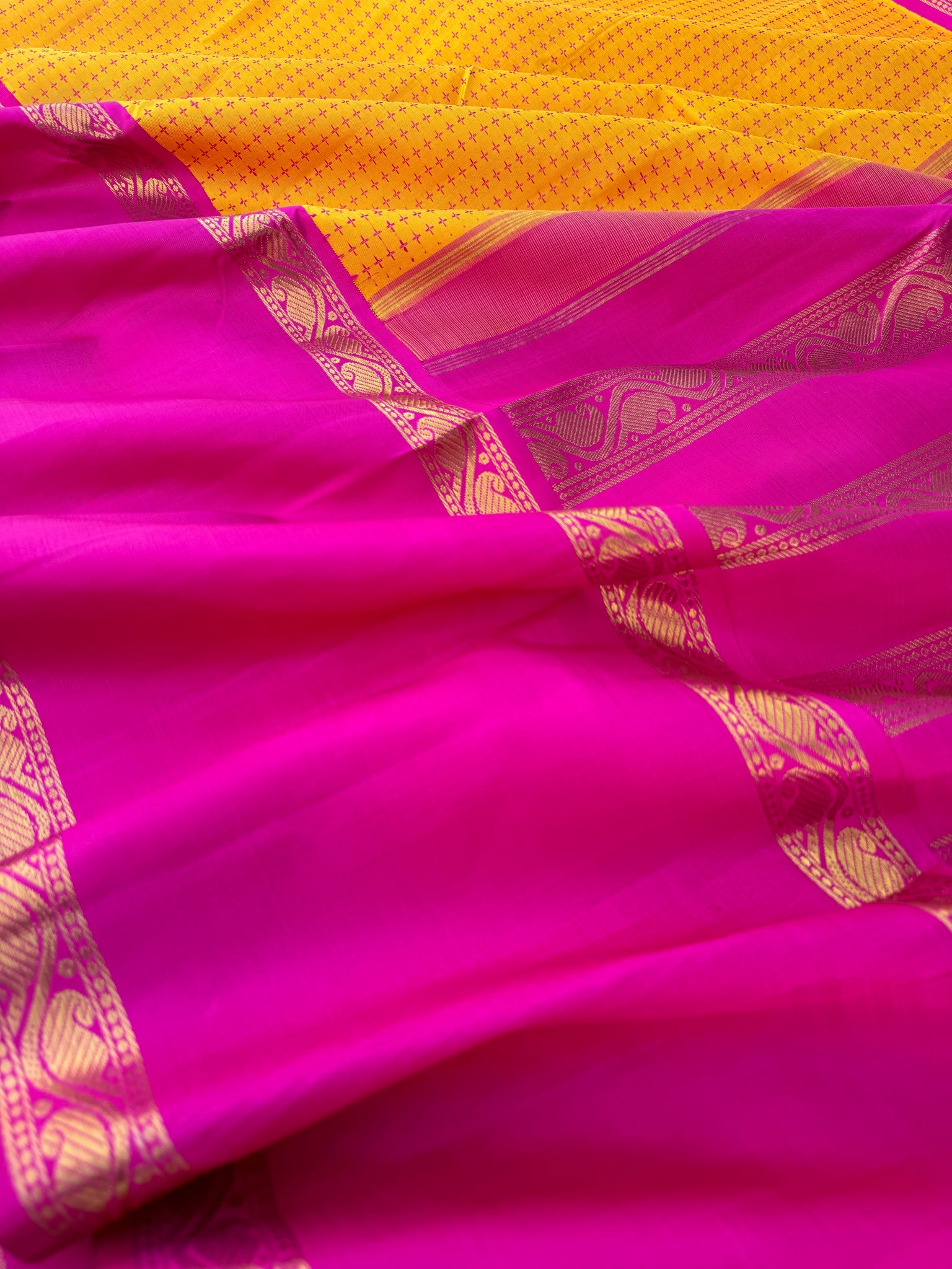 Essence of Traditional Kanchivarams - a gorgeous vintage type broad borders mustard and sweet pink full body woven pluse buttas