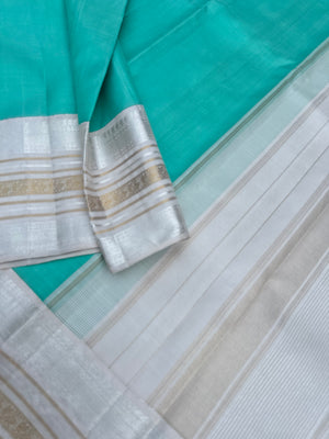Diwali Edits - Soulful Kanchivaram - A pastel aqua green with silver and gold Zari Korvai ivory korvai borders