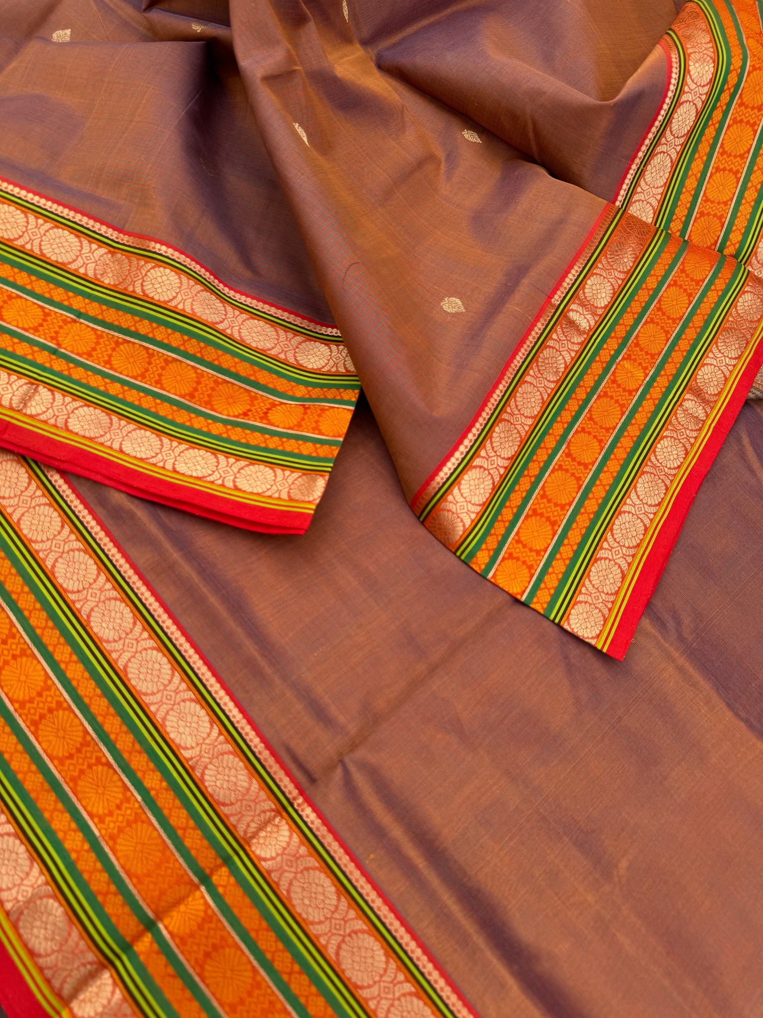 Zari Kissed Silk Cotton - a caramel mustard dual tone varusai pett woven border