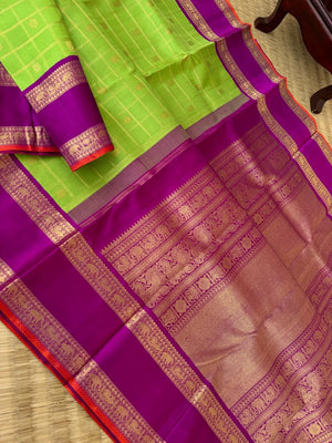 Tales of Korvais Kanchivaram - the fresh green and purple with kattam buttas woven body
